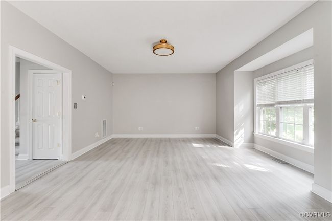 Large, open great room, light wood-style flooring | Image 9