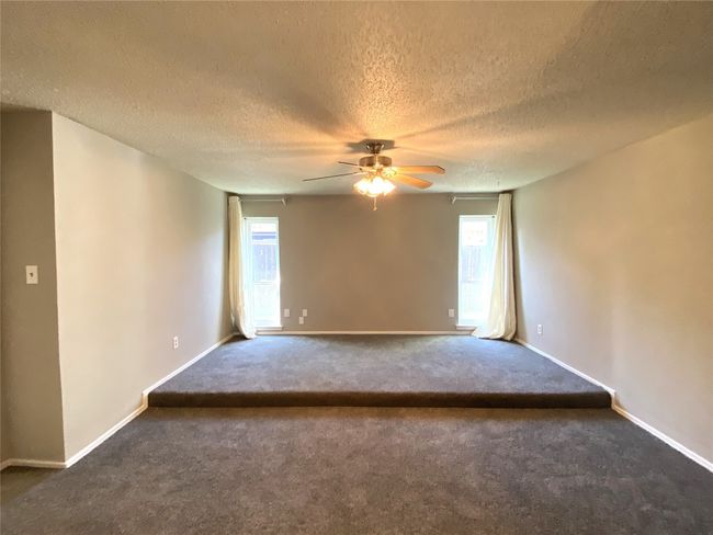 Primary bedroom with room for a sitting area. | Image 7