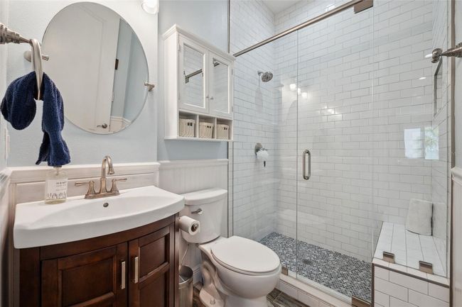 Full bath with walk-in shower and bench seat located on the second floor, just adjacent to the bedroom/office. | Image 58