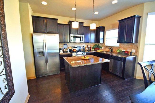 kitchen with island and granite counter top | Image 8