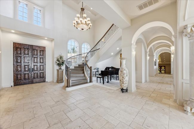 The gorgeous formal entry with solid marble columns imported from Italy, and Segreto finish details. | Image 6