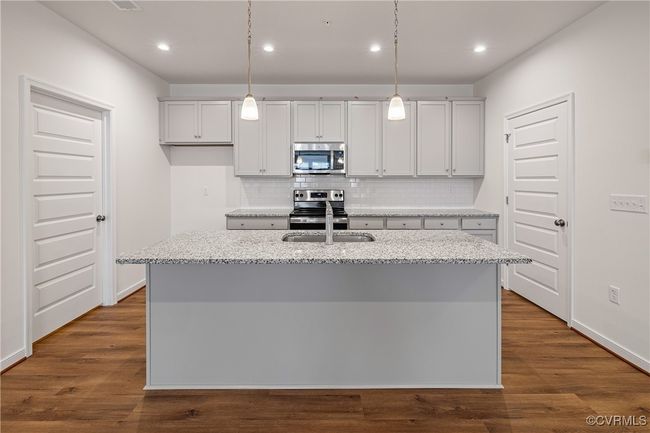 You'll love gathering with loved ones around this spacious center island! HOME IS UNDER CONSTRUCTION - Photo is from builder's library and shown as an example only (colors, features and options will vary). | Image 7