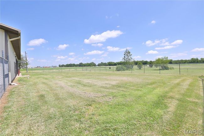 View of yard & fenced in area | Image 55