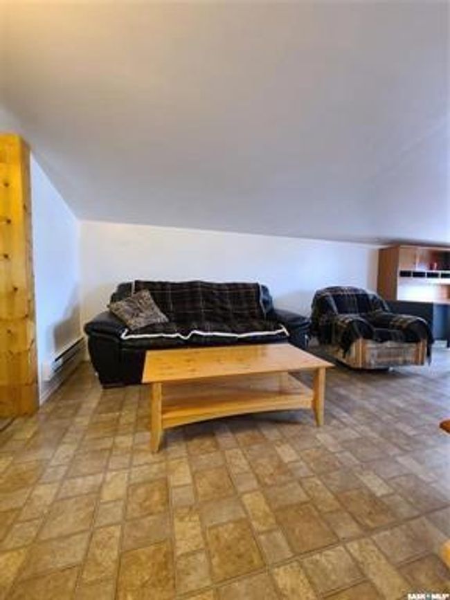 Living room featuring vaulted ceiling | Image 35
