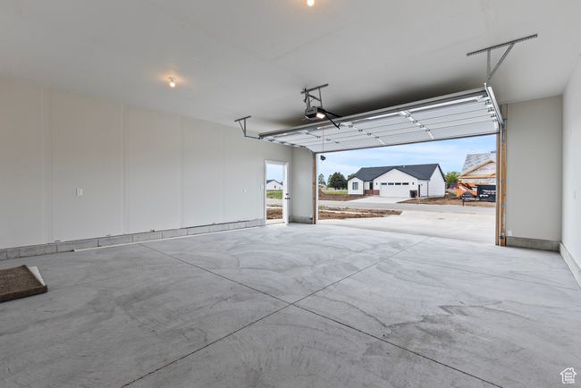 Garage with a garage door opener | Image 21