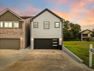 Welcome to 118 Capetown, a charming two-story home with a contemporary aesthetic, featuring a blend of classic brick and sleek siding for enhanced curb appeal. Your home is meticulously updated, boasts a brand-new HVAC system installed in August 2024, ensuring year-round comfort. The roof was replaced in 2019, adds peace of mind for years to come. | Image 1