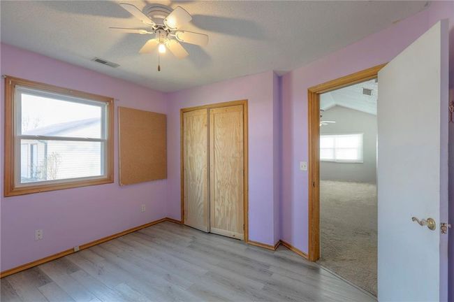 Unfurnished bedroom featuring baseboards, visible vents, and a closet | Image 14
