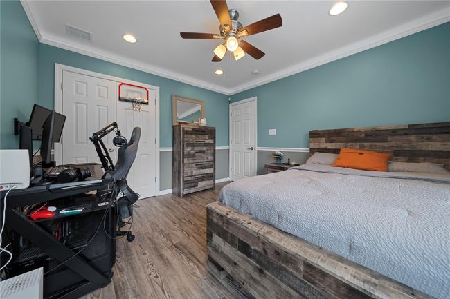 Home office with wood finished floors, wooden ceiling, wood walls, vaulted ceiling, and recessed lighting | Image 30