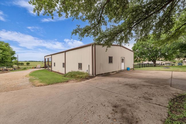 View of pole building with concrete driveway | Image 16