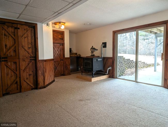 Lower level family room with sliding doors to patio and backyard | Image 35