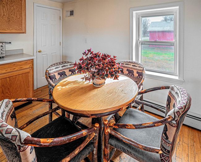 Dining area with light hardwood / wood-style flooring | Image 19