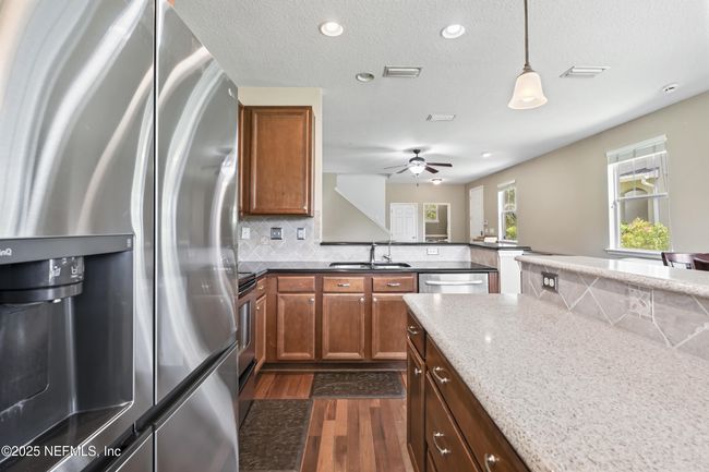 Kitchen island, bar open for entertaining | Image 16