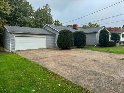 View of front facade with a front lawn | Image 2