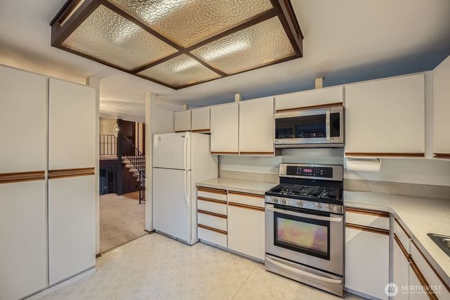 Storage pantry cabinets to the left and enough room for a small table. | Image 17