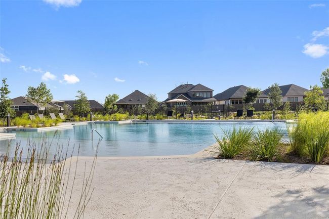 Community pool with a residential view | Image 28