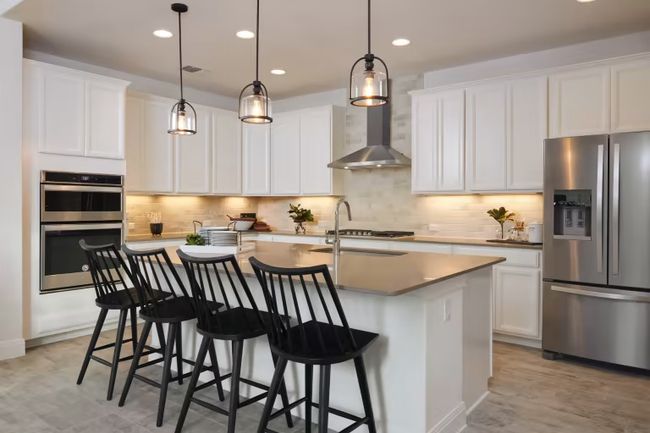 Photo of Pulte model home with same floor plan, not of actual home listed. | Image 11