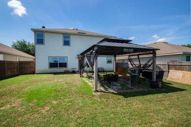 Rear view of house featuring a gazebo and a patio area | Image 25