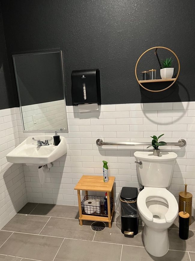 Half bath featuring tile walls, tile patterned floors, and wainscoting | Image 17
