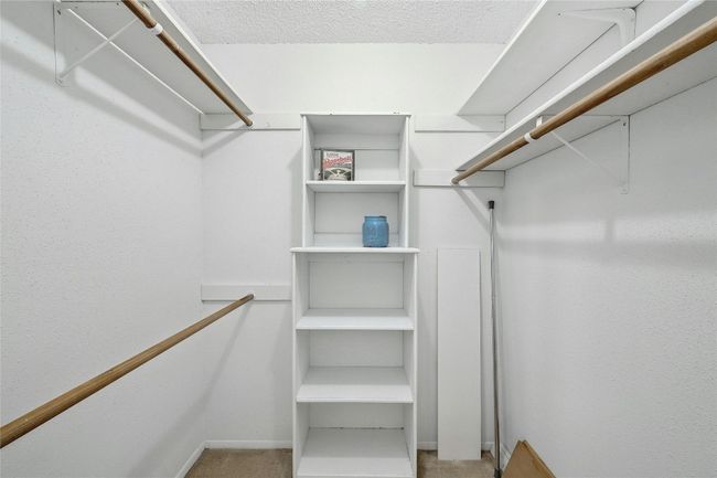 Large walk in closet in primary bedroom. | Image 13