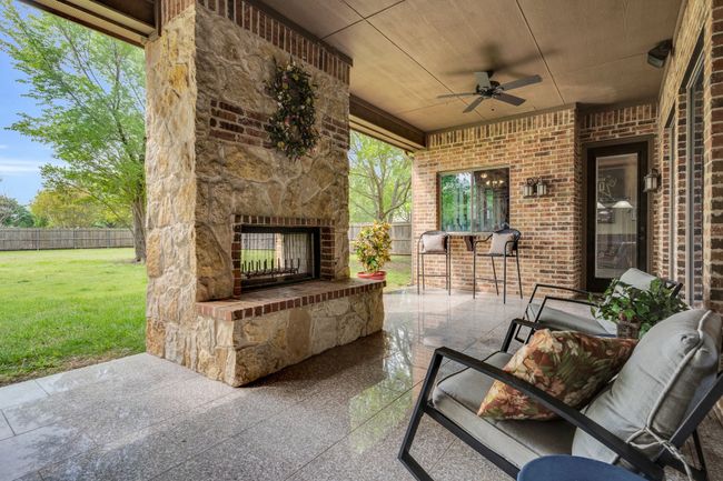 Outdoor stone fireplace on patio | Image 38