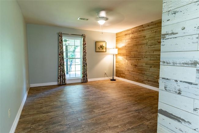 View of primary bedroom from door to den. | Image 29