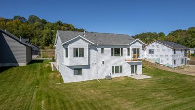 Convenience of a walkout lower level that opens directly to a lovely patio, overlooking the serene golf course. This inviting outdoor space is perfect for relaxing or entertaining while soaking in the beautiful views. | Image 3