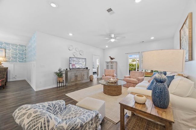 Living room with ceiling fan, visible vents, recessed lighting, and wood finished floors | Image 17