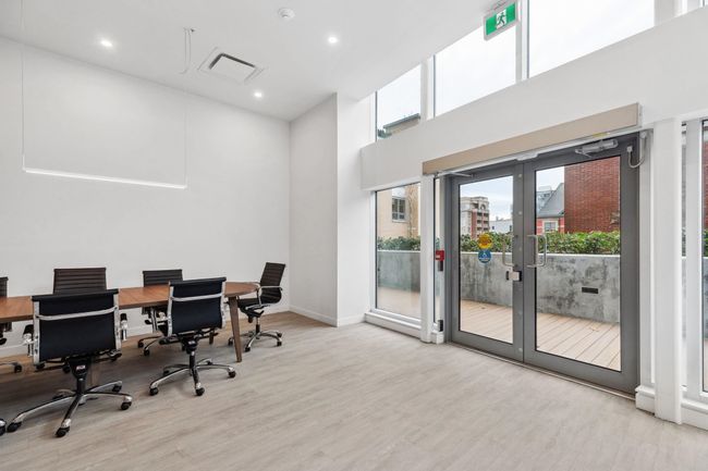 Home office featuring french doors, wood finished floors, baseboards, a towering ceiling, and recessed lighting | Image 21
