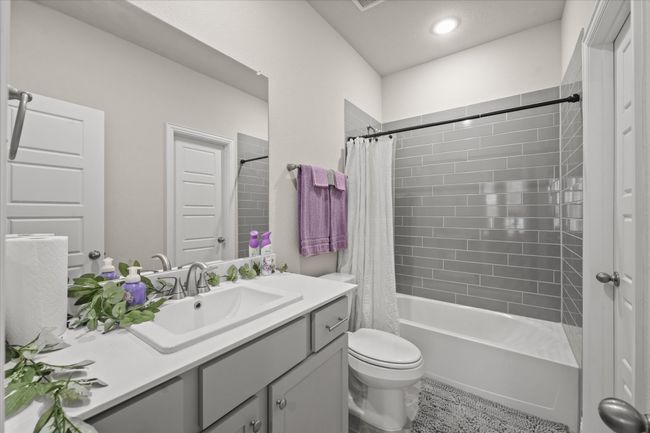 Full bathroom with vanity, shower / bathtub combination with curtain, and recessed lighting | Image 14