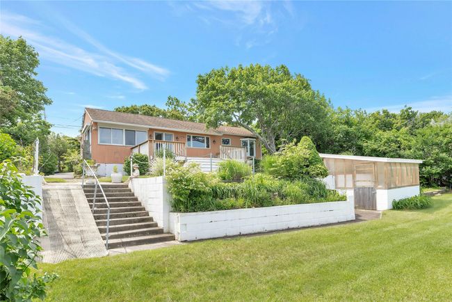 Rear view of house featuring stairway and a lawn | Image 20