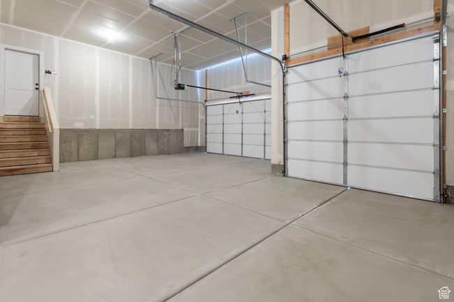 Garage with a garage door opener | Image 23