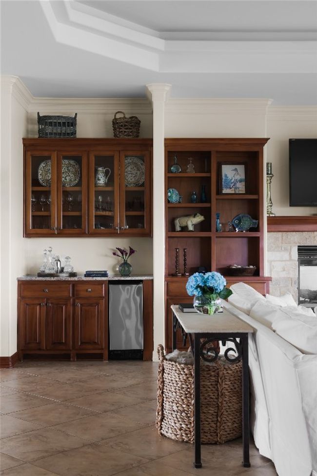 Indoor dry bar with crown molding and refrigerator | Image 23