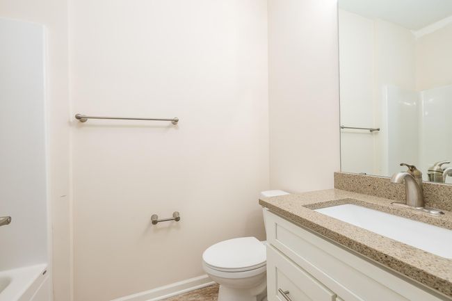 Hall bathroom, boasts a full bath on the main level! | Image 23