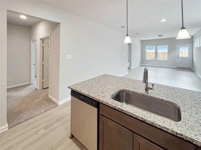 The Cardinal II- Kitchen into Family Room. Home under construction. Sample floor plan photo used for illustrative purposes only. Upgrades, selections options, windows and colors may vary. | Image 4