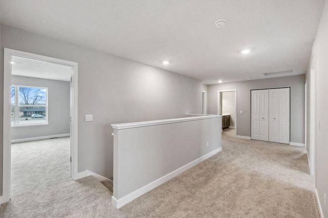 Spacious hallway leading to bedrooms and loft. Model photos. Options and colors will vary. | Image 27