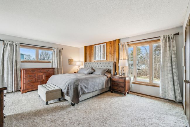 Upper level owners suite with plush carpet private 3/4 bathroom and a large walk-in closet | Image 22