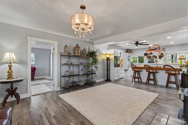 Complete open concept with kitchen and living room area for plenty of conversation while taking care of kitchen business. | Image 18