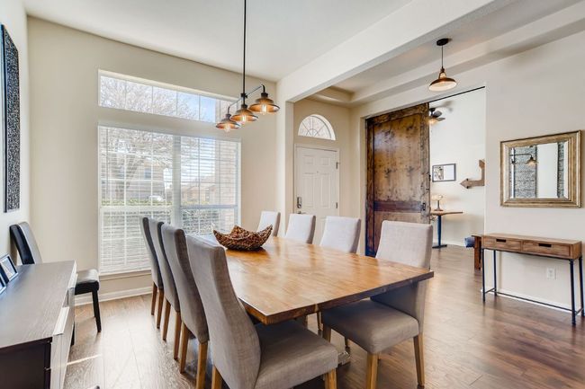 Dining room with dark wood finished floors | Image 7