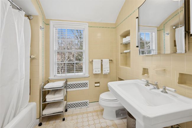 Sunny Primary bathroom with original details | Image 24