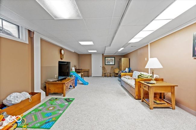 playroom with carpet flooring and a drop ceiling | Image 33