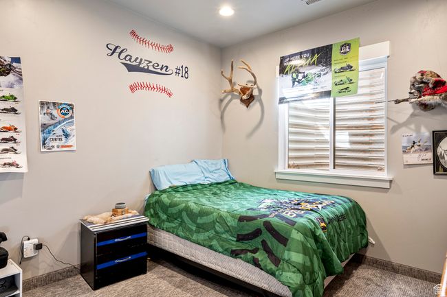 Bedroom featuring carpet, multiple windows, and baseboards | Image 32