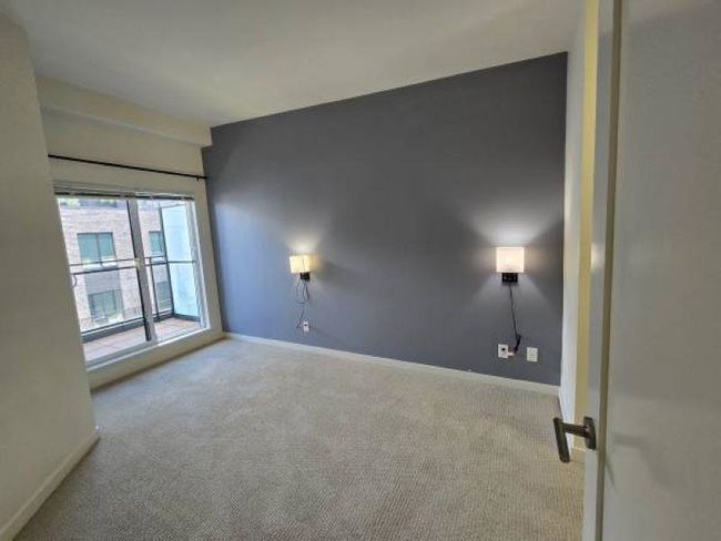 Carpeted spare room featuring baseboards | Image 9