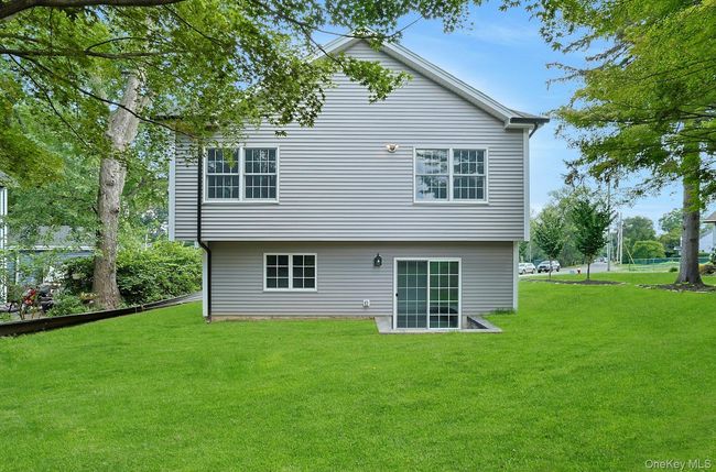 Back of house featuring a yard | Image 32