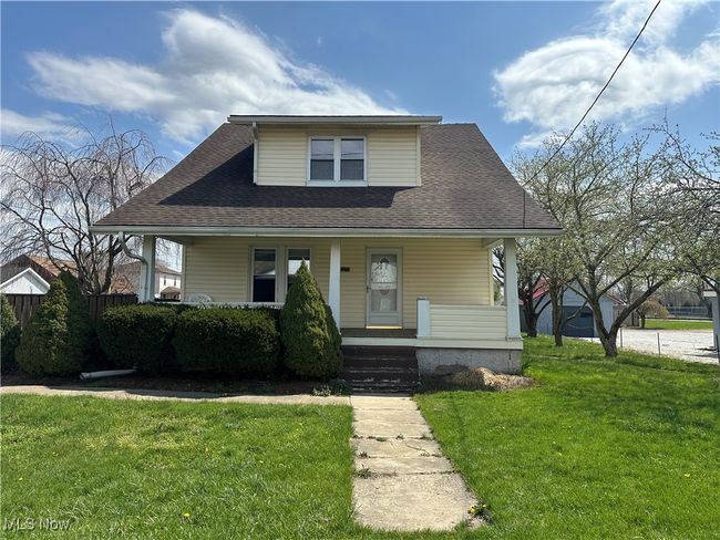 Bungalow-style house featuring roof with shingles, a porch, and a front yard | Image 20