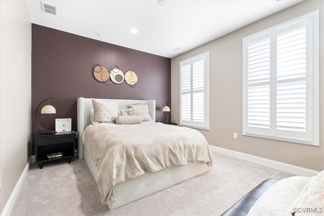 Bedroom featuring recessed lighting, light carpet, visible vents, and baseboards | Image 30