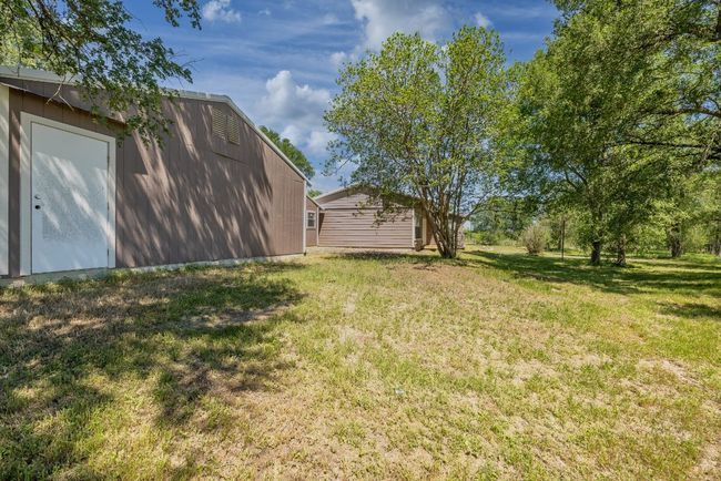 View of yard featuring an outdoor structure | Image 40