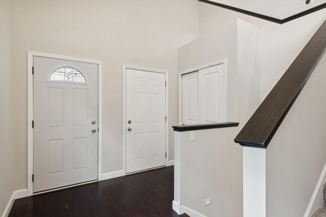 Welcome home! This foyer is spacious and bright. Beautiful floors and amazing natural light here! | Image 14