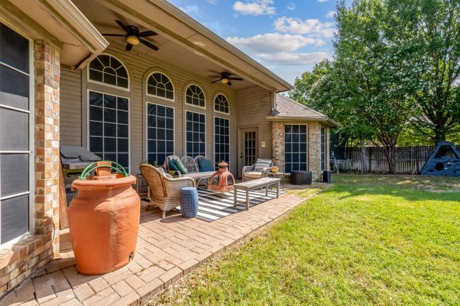View of patio featuring a ceiling fan, an outdoor living space, and a grill | Image 35