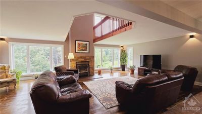 Primary Residence Living Room with wood-burning fireplace & refinished hardwood floors | Image 3