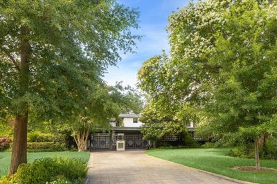 Private, pristine and serene describes this renovated and expanded historic home, which owes its roots to a match up of Art Moderne + Prairie School styles of architecture. | Image 1